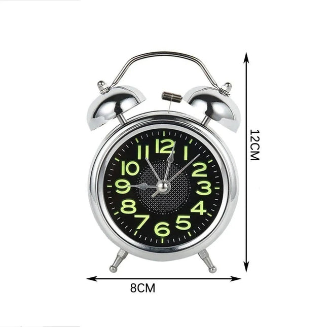 Analoge wekker met lichtgevende nummers