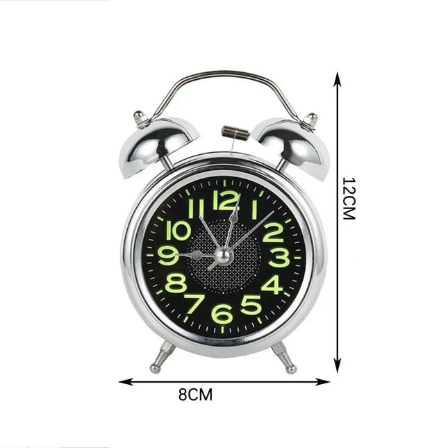 Analoge wekker met lichtgevende nummers