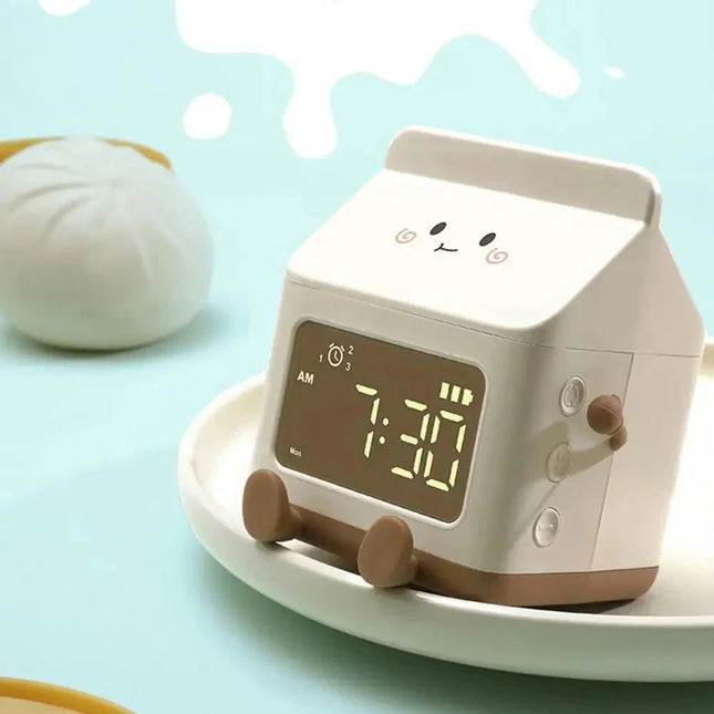 Kinderwekker in de vorm van melkpak