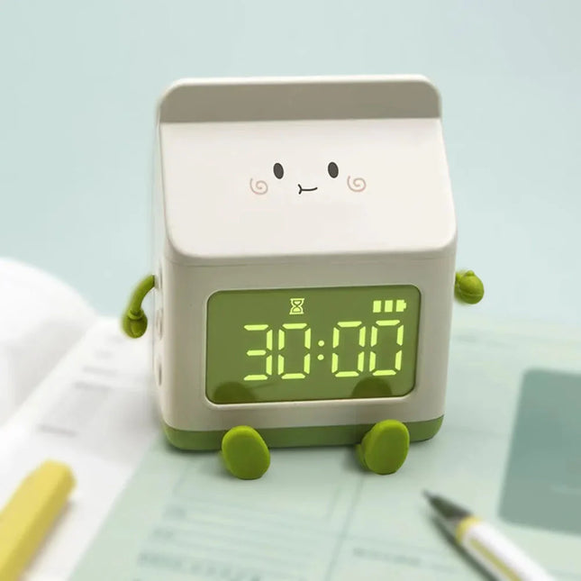 Kinderwekker in de vorm van melkpak