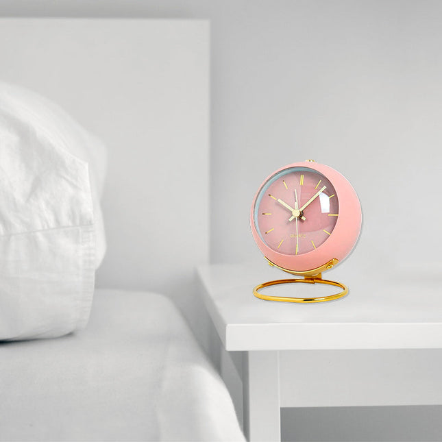 Stille ronde roze wekker vintage